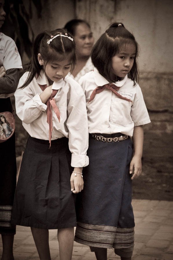 Traditional Laotian skirts and obligatory red scarfs