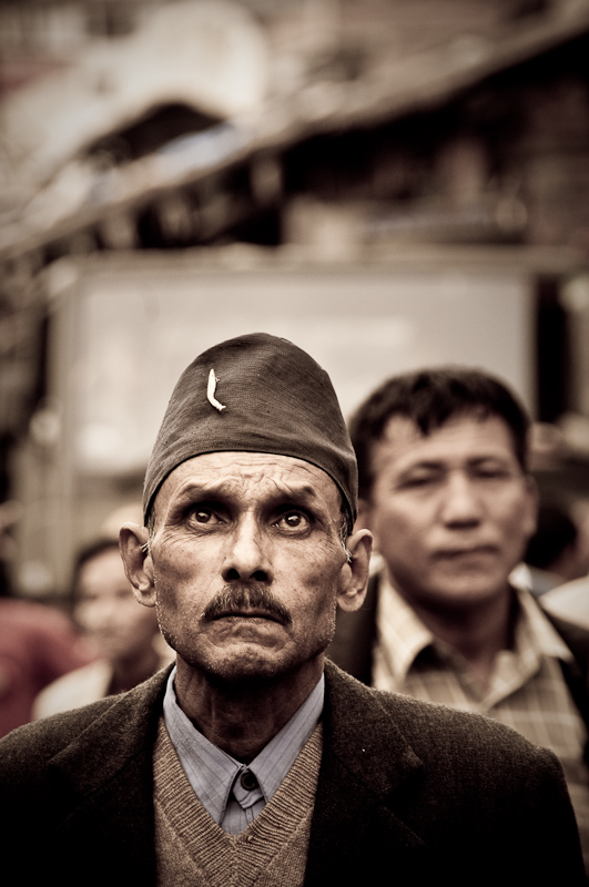 Man listening to speeches on communist gathering in India