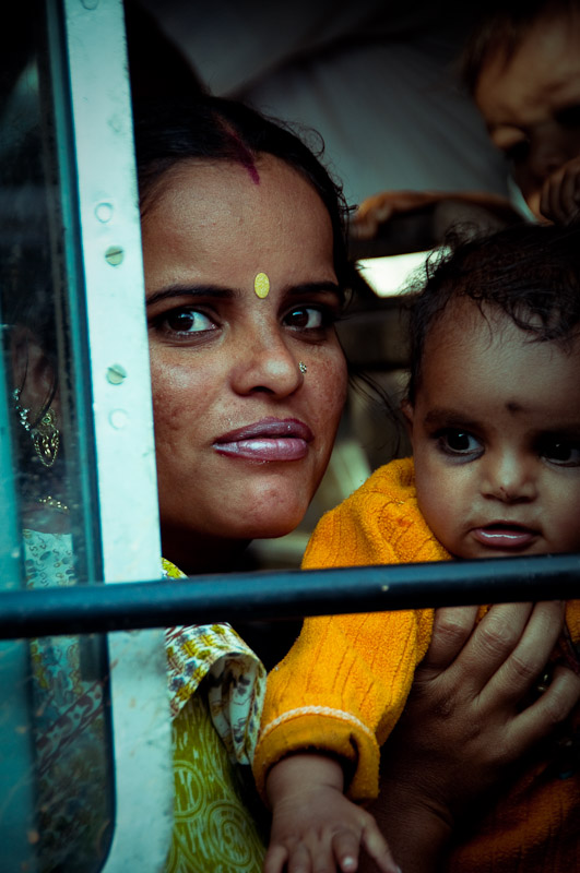 Indian Mother, portrait through the train window